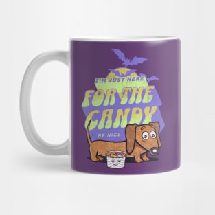 Funny cute spooky creepy Halloween Doxie Dachshund getting candy from trick or treaters and being nice Mug